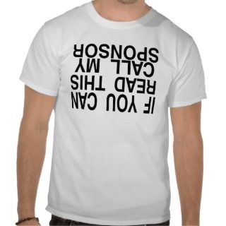 Someone wearing a shirt that says, printed upside down, 
